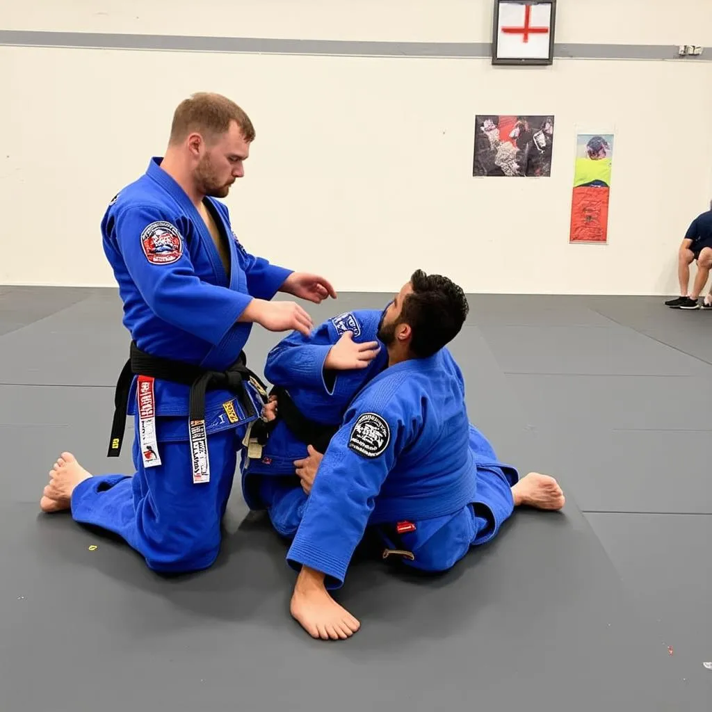 Huấn luyện viên BJJ hướng dẫn học viên