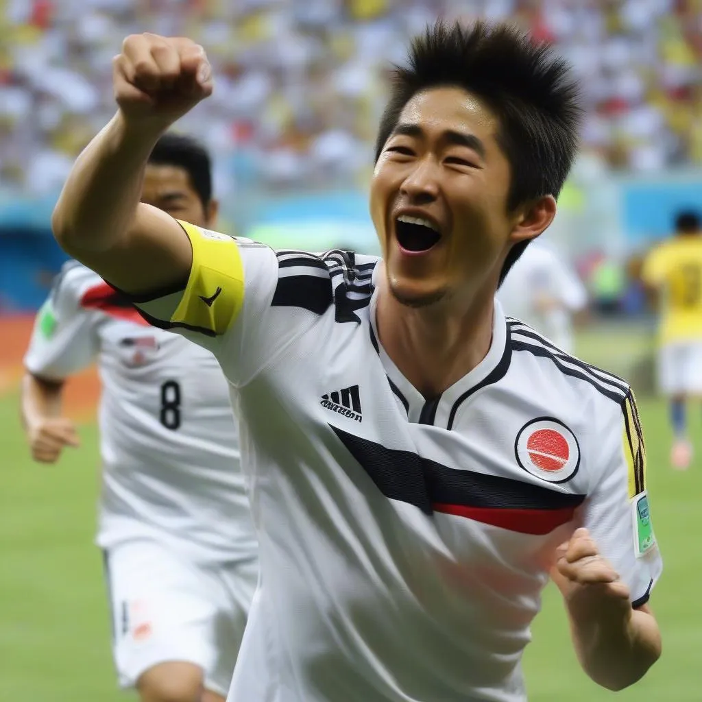 Shinji Kagawa celebrates after scoring a goal for Japan against Colombia in the 2014 World Cup